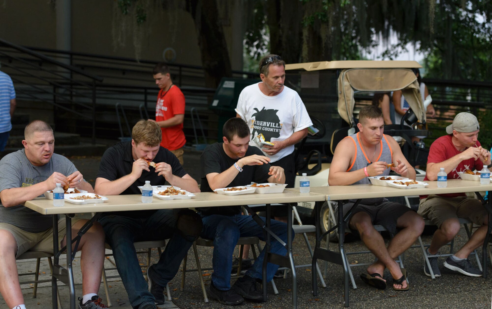 Keesler personnel and families participate in the hot wings eating competition during Freedom Fest at Marina Park on Keesler Air Force Base, Mississippi, June 30, 2018. The event included carnival rides, a burger cook-off, a watermelon eating competition and a fireworks display. (U.S. Air Force photo by Andre’ Askew)
