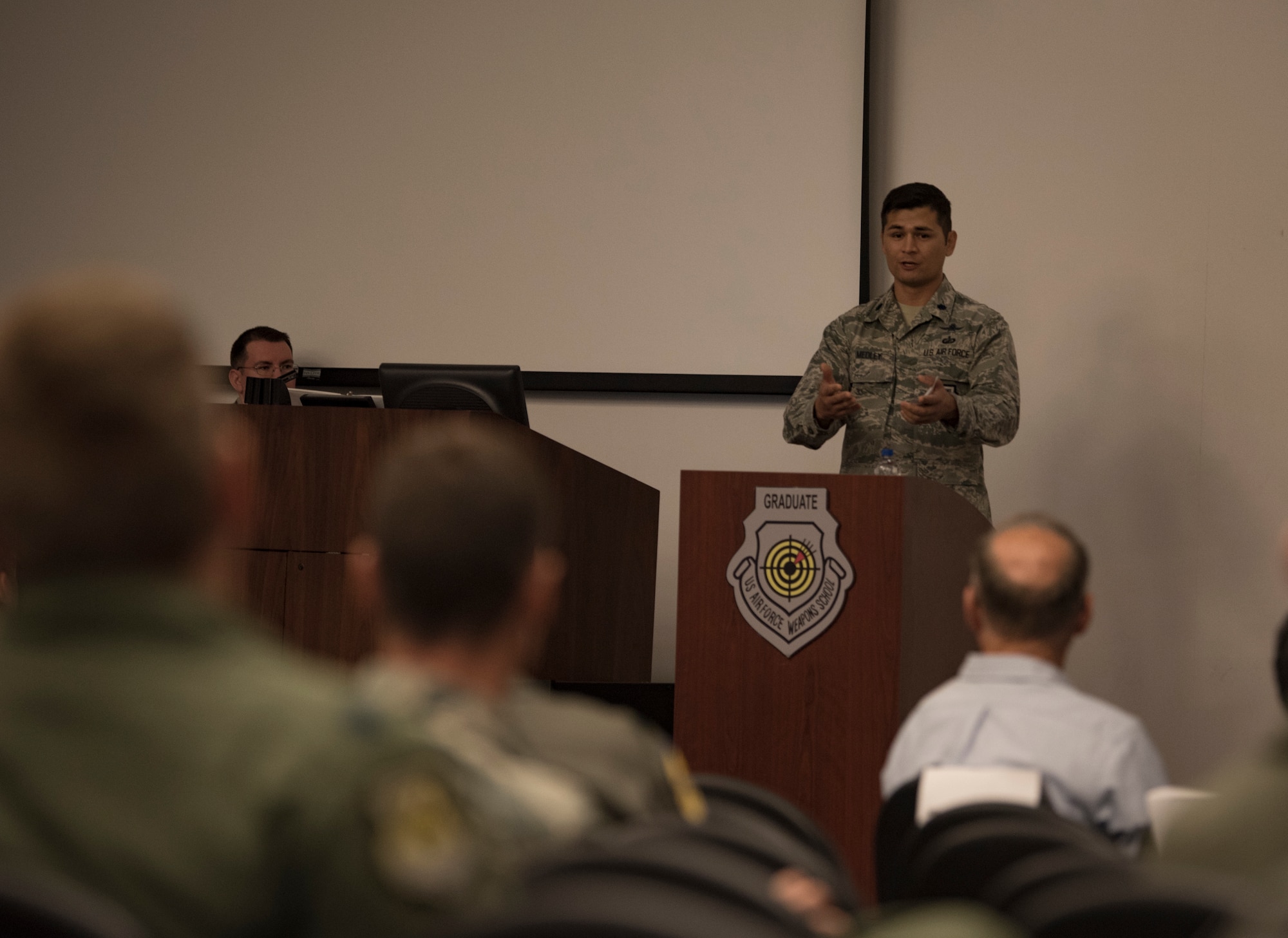 Lt. Col. Douglas Medley, 32nd Weapons Squadron commander, gives a speech during an assumption of command ceremony at Nellis Air Force Base, Nevada, June 28, 2018. Medley graduated from the U.S. Air Force Weapons School in 2012 and is returning as the 32nd WPS squadron commander, focusing on Cyber Warfare Operations Weapons Instructor Course. (U.S. Air Force photo by Airman 1st Class Andrew D. Sarver)