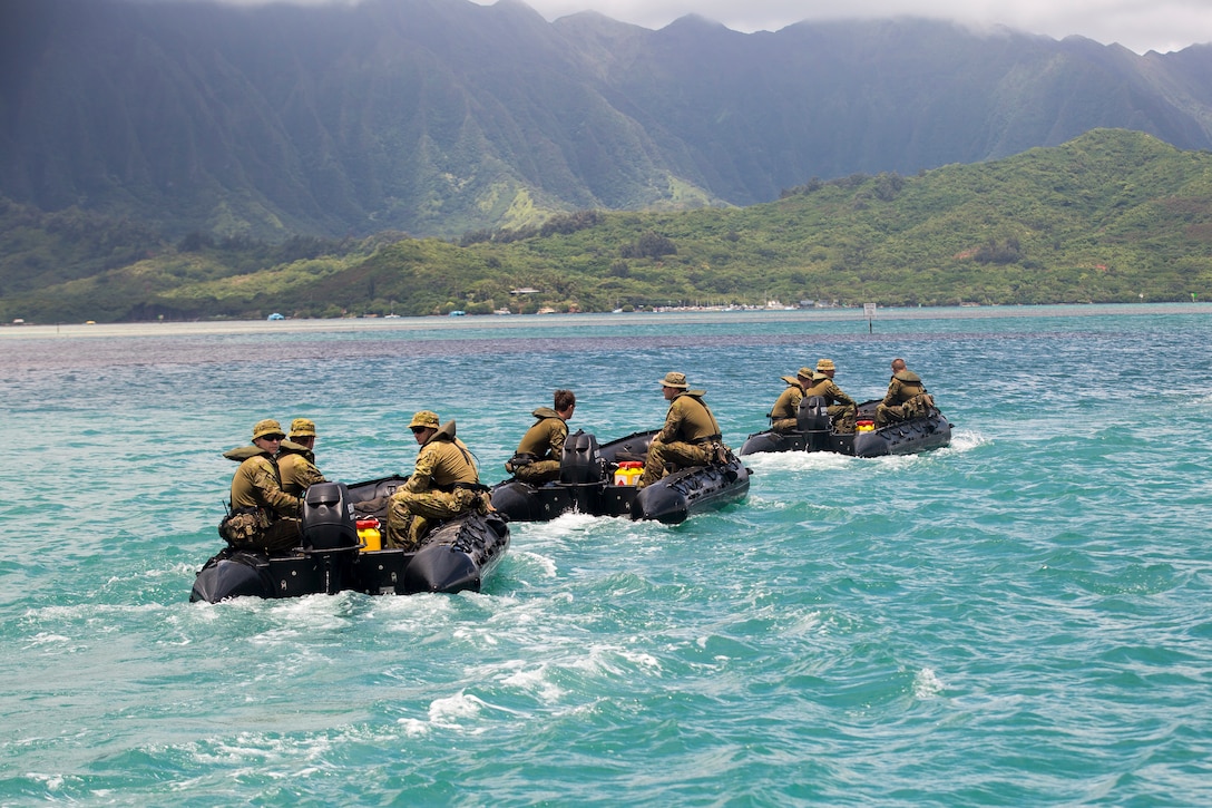 Australian soldiers with the Royal Australian Regiment ride in Zodiac Mark 2 Grand Raider general purpose inflatable boats during a beach insertion rehearsal as part of Rim of the Pacific (RIMPAC) exercise Marine Corps Base Hawaii July 1, 2018. RIMPAC provides high-value training for task-organized, highly-capable Marine Air-Ground Task Force and enhances the critical crisis response capability of U.S. Marines in the Pacific. Twenty-five nations, 46 ships, five submarines, about 200 aircraft and 25,000 personnel are participating in RIMPAC from June 27 to Aug. 2 in and around the Hawaiian Islands and Southern California. (U.S. Marine Corps photo by Sgt. Zachary Orr)
