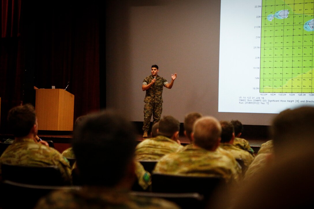 U.S. and foreign service members attend a safety brief in relation to the Rim of the Pacific (RIMPAC) exercise at the base theater aboard Marine Corps Base Hawaii (MCBH) June 27, 2018. The brief informed exercise participants on the rules, regulations, and requirements for all ranges and training areas aboard MCBH. The brief also provided awareness of the cultural and natural resources related to MCBH. Twenty-five nations, more than 45 ships and submarines, about 200 aircraft, and 25,000 personnel are participating in RIMPAC from June 27 to Aug. 2 in and around the Hawaiian Islands and Southern California. The world's largest international maritime exercise, RIMPAC provides a unique training opportunity while fostering and sustaining cooperative relationships among participants critical to ensuring the safety of sea lanes and security on the world's oceans.