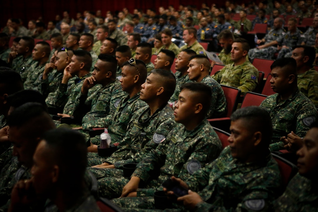 U.S. and foreign service members attend a safety brief in relation to the Rim of the Pacific (RIMPAC) exercise at the base theater aboard Marine Corps Base Hawaii (MCBH) June 27, 2018. The brief informed exercise participants on the rules, regulations, and requirements for all ranges and training areas aboard MCBH. The brief also provided awareness of the cultural and natural resources related to MCBH. Twenty-five nations, more than 45 ships and submarines, about 200 aircraft, and 25,000 personnel are participating in RIMPAC from June 27 to Aug. 2 in and around the Hawaiian Islands and Southern California. The world's largest international maritime exercise, RIMPAC provides a unique training opportunity while fostering and sustaining cooperative relationships among participants critical to ensuring the safety of sea lanes and security on the world's oceans. RIMPAC 2018 is the 26th exercise in the series that began in 1971.