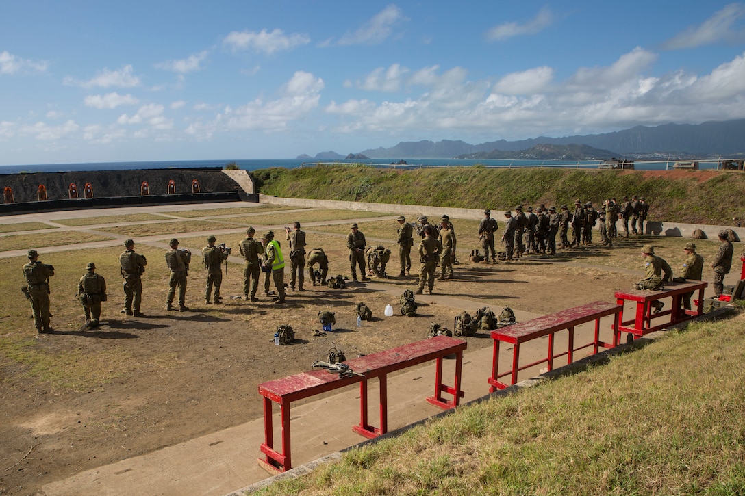 U.S. Marines with Marine Air-Ground Task Force-Hawaii and Australian soldiers with 2nd Battalion, Royal Australian Regiment observe targets down range prior to a live-fire training as part of Rim of the Pacific (RIMPAC) exercise at the Ulupa’u Crater Range Training Facility on Marine Corps Base Hawaii June 29, 2018. RIMPAC provides high-value training for task-organized, highly-cabable Marine Air-Ground Task Force and enhances the critical crisis response capability of U.S. Marines in the Pacific. Twenty-five nations, 46 ships, five submarines, about 200 aircraft and 25,000 personnel are participating in RIMPAC from June 27 to Aug. 2 in and around the Hawaiian Islands and Southern California.