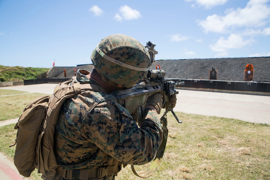 U.S. Navy Hospital Nicholas Perez, a corpsman with Marine Air-Ground Task Force-Hawaii, fires an enhanced F88 Austeyr rifle during a live fire training event as part of Rim of the Pacific (RIMPAC) exercise at the Ulupa’u Crater Range Training Facility on Marine Corps Base Hawaii June 29, 2018. RIMPAC provides high-value training for task-organized, highly-capable Marine Air-Ground Task Force and enhances the critical crisis response capability of U.S. Marines in the Pacific. Twenty-five nations, 46 ships, five submarines, about 200 aircraft and 25,000 personnel are participating in RIMPAC from June 27 to Aug. 2 in and around the Hawaiian Islands and Southern California.