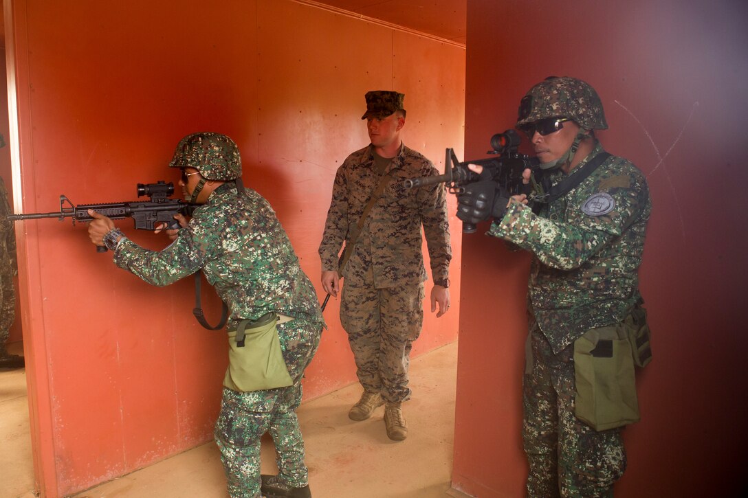 Philippine Marines practice clearing a room during urban operations training as part of the Rim of the Pacific (RIMPAC) exercise aboard Marine Corps Base Hawaii June 28, 2018. Marines training with the U.S. Navy and partner nations from around the world enhances prowess. RIMPAC provides high-value training for task-organized, highly-capable Marine Air-Ground Task Force and enhances the critical crisis response capability of U.S. Marines in the Pacific. Twenty-five nations, more than 45 ships and submarines, about 200 aircraft, and 25,000 personnel are participating in RIMPAC from June 27 to Aug. 2 in and around the Hawaiian Islands and Southern California.