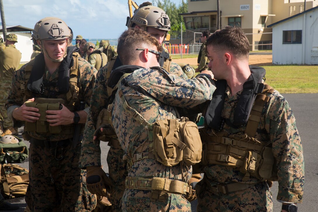 U.S. Marines with the 3rd Reconnaissance Battalion inspect gear prior to helo-cast drills during Rim of the Pacific (RIMPAC) exercise on Marine Corps Base Hawaii June 29, 2018. The helo-cast training is meant to prepare the service members for an amphibious insertion during RIMPAC. RIMPAC provides high-value training for task-organized, highly-capable Marine Air-Ground Task Force and enhances the critical crisis response capability of U.S. Marines in the Pacific. Twenty-five nations, 46 ships, five submarines, about 200 aircraft and 25,000 personnel are participating in RIMPAC from June 27 to Aug. 2 in and around the Hawaiian Islands and Southern California.