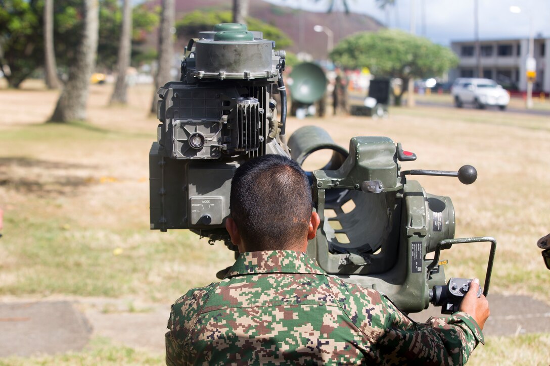 An Indonesian Marine tests out Marine Corps equipment during Indoor Simulated Marksmanship Trainer during Rim of the Pacific (RIMPAC) on Marine Corps Base Hawaii June 30, 2018. RIMPAC provides high-value training for task-organized, highly-capable Marine-Air Ground Task Force and enhances the critical crisis response capability of U.S. Marines in the Pacific. Twenty-five nations, more than 45 ships and submarines, about 200 aircraft, and 25,000 personnel are participating in RIMPAC from June 27 to Aug. 2 in and around the Hawaiian Islands and Southern California. The world's largest international maritime exercise, RIMPAC provides a unique training opportunity while fostering and sustaining cooperative relationships among participants critical to ensuring the safety of sea lanes and security on the world's oceans.