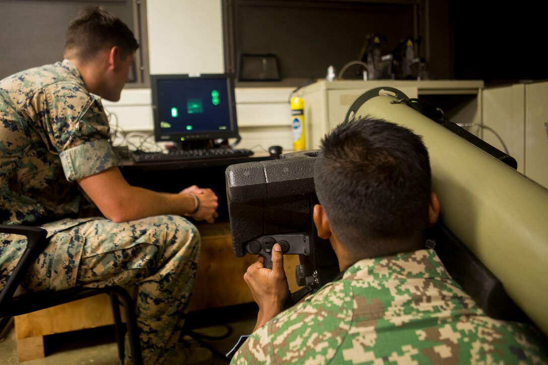 Indonesian Marine Lance Cpl. Bin Mohamad Azizul with the 10th Brigade Paratroopers tests an FGM-148 Javelin shoulder-fired anti-tank missile in an indoor simulated marksmanship trainer during Rim of the Pacific (RIMPAC) exercise on Marine Corps Base Hawaii June 30, 2018. RIMPAC provides high-value training for task-organized, highly-capable Marine Air-Ground Task Force and enhances the critical crisis response capability of U.S. Marines in the Pacific. Twenty-five nations, 46 ships, five submarines, about 200 aircraft and 25,000 personnel are participating in RIMPAC from June 27 to Aug. 2 in and around the Hawaiian Islands and Southern California.