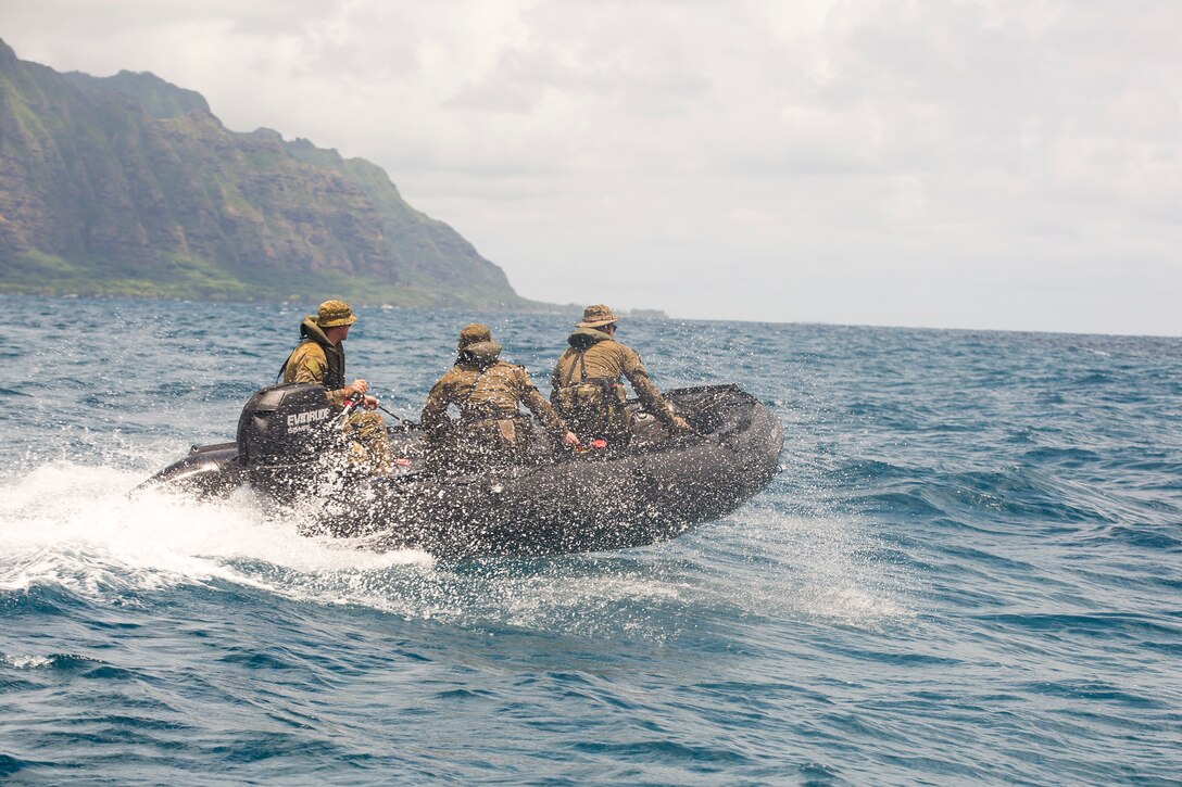Australian soldiers with the Royal Australian Regiment ride in a Zodiac Mark 2 Grand Raider general purpose inflatable boat during a beach insertion rehearsal as part of Rim of the Pacific (RIMPAC) exercise Marine Corps Base Hawaii July 1, 2018. RIMPAC provides high-value training for task-organized, highly-capable Marine Air-Ground Task Force and enhances the critical crisis response capability of U.S. Marines in the Pacific. Twenty-five nations, 46 ships, five submarines, about 200 aircraft and 25,000 personnel are participating in RIMPAC from June 27 to Aug. 2 in and around the Hawaiian Islands and Southern California.
