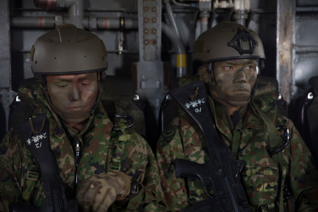 Japanese soldiers with 2nd Regiment, Amphibious Rapid Deployment Brigade, sit in a CH-53E Super Stallion helicopter during amphibious operations as part of Rim of the Pacific (RIMPAC) exercise on Marine Corps Base Hawaii July 2, 2018. Twenty-Five nations, more than 45 ships and submarines, about 200 aircraft, and 25,000 personnel are participating in RIMPAC from June 27 to Aug. 2 in and around the Hawaiian Islands and Southern California. The world's largest international maritime exercise, RIMPAC provides a unique training opportunity while fostering and sustaining cooperative relationships among participants critical to ensuring the safety of sea lanes and security of the world's oceans.