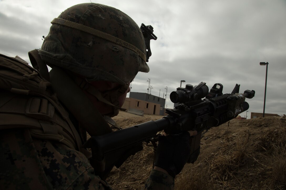 U.S. Marine Corps Cpl. Killian Shelton, a squad leader with Company F, 2nd Battalion, 1st Marine Regiment, prepares to lead Marines in a simulated raid at a combat town as part of Rim of the Pacific (RIMPAC) exercise at Marine Corps Base Camp Pendleton, California, July 3, 2018. RIMPAC demonstrates the value of amphibious forces and provides high-value training for task-organized, highly-capable Marine Air-Ground Task Forces enhancing the critical crisis response capability of U.S. Marines in the Pacific. Twenty-five nations, 46 ships, five submarines, about 200 aircraft and 25,000 personnel are participating in RIMPAC from June 27 to Aug. 2 in and around the Hawaiian Islands and Southern California.