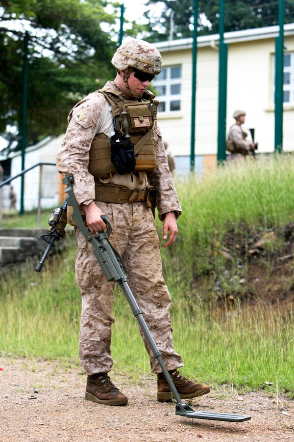 U.S. Marine Corps Lance Cpl. Johnathan Scare, combat engineer with Marine Rotational Force Darwin, conducts a sweep with a compact metal detector, or CMD, at Koumac, New Caledonia, May 20, 2018. Sweeps are typically conducted to search for materials in the ground that may be used against friendly forces or be of intelligence value. “Combat engineering gives you the opportunity to learn many skills, and I’d like to be able have as many as possible for any projects that I may take on in the future,” said Scare. (U.S. Marine Corps photo by Cpl. Mason Roy)