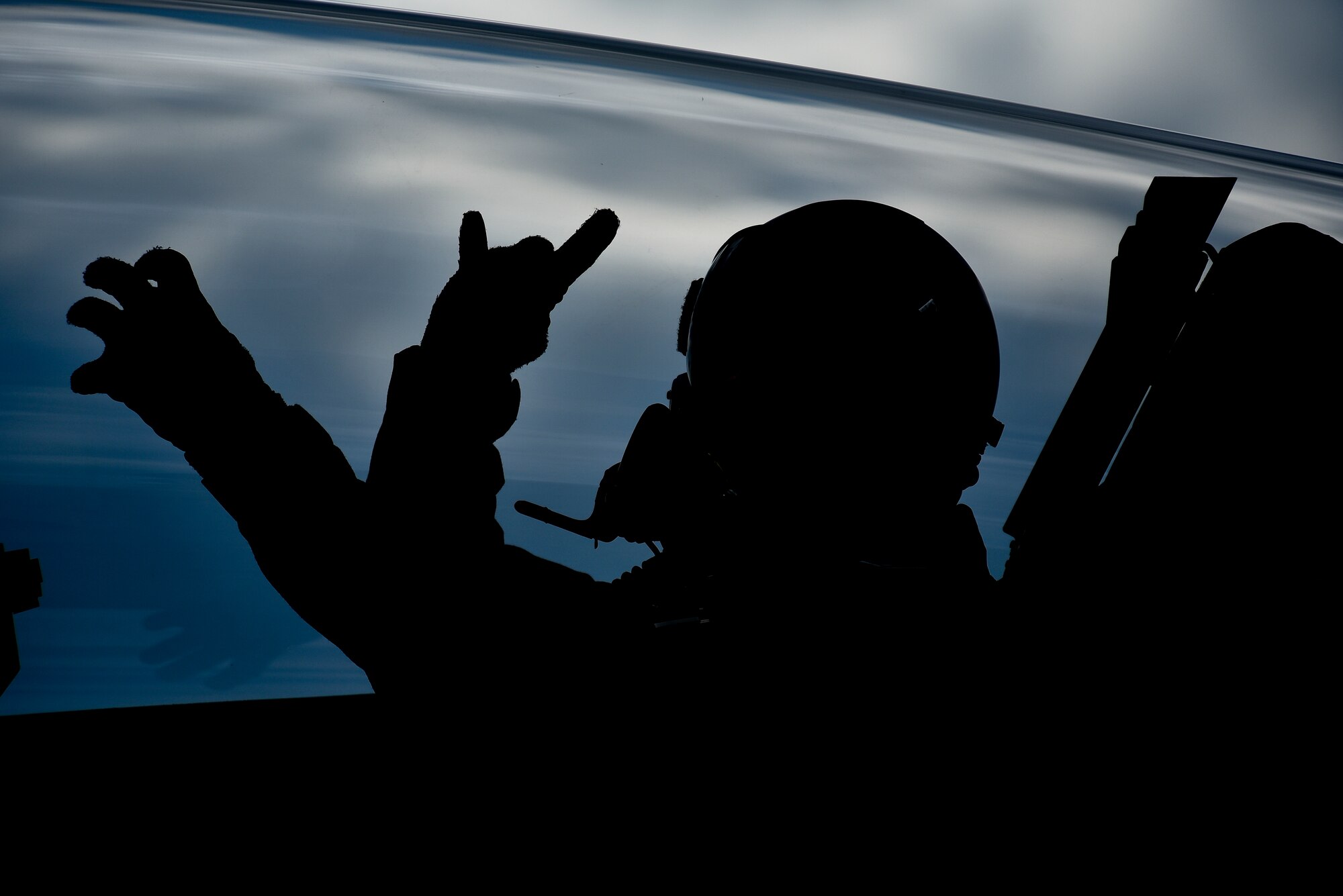 U.S. Air Force Col. R. Scott Jobe, the 35th Fighter Wing commander, throws up the 13th and 14th Fighter Squadrons' signs, respectively, before an F-2 familiarization flight at Misawa Air Base, Japan, June 22, 2018. This flight allowed Jobe to experience Japan Air Self-Defense Force tactics and aircraft capabilities. (U.S. Air Force photo by Airman 1st Class Collette Brooks)
