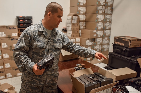 Tech. Sgt. Webb unboxes mobile APX 6500 mobile radios