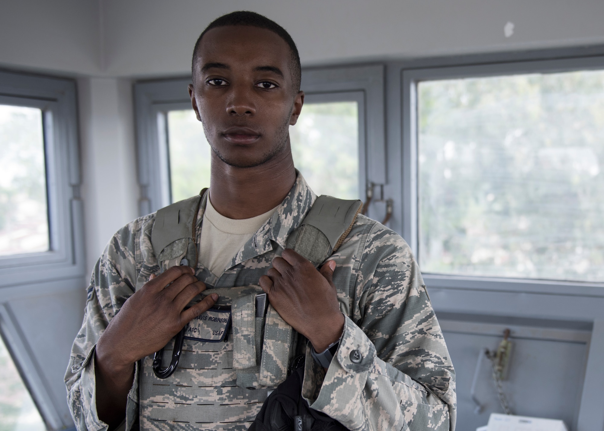 U.S. Air Force Airman 1st Class Chavis Robinson, a 39th Security Forces Squadron contingency member, poses for a photo in a watch tower at Incirlik Air Base, Turkey, June 21, 2018.