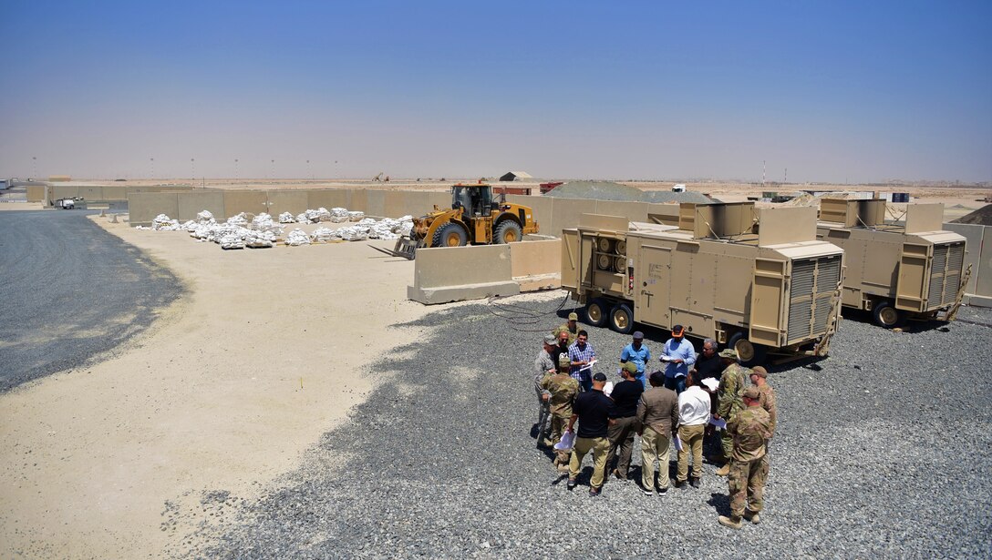 Members from the 386th Expeditionary Contracting Squadron speak to prospective clients at Abdullah Al Mubarak Air Base, Kuwait, June 25, 2018. The 386 ECONS is responsible for awarding contracts to local vendors for services rendered and product acquisition for the Air Force Central Command area of responsibility. (U.S. Air Force photo by Staff Sgt. Christopher Stoltz)