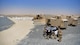 Members from the 386th Expeditionary Contracting Squadron speak to prospective clients at Abdullah Al Mubarak Air Base, Kuwait, June 25, 2018. The 386 ECONS is responsible for awarding contracts to local vendors for services rendered and product acquisition for the Air Force Central Command area of responsibility. (U.S. Air Force photo by Staff Sgt. Christopher Stoltz)