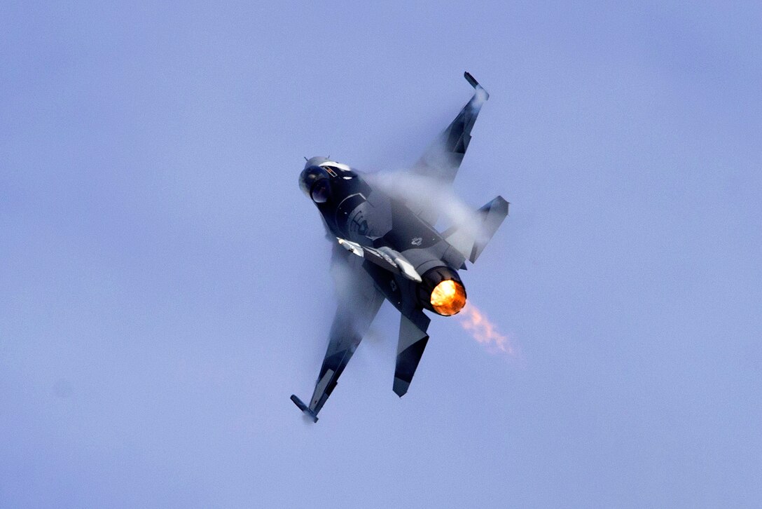 An Air Force F-16 Fighting Falcon demonstrates aerial maneuvers.
