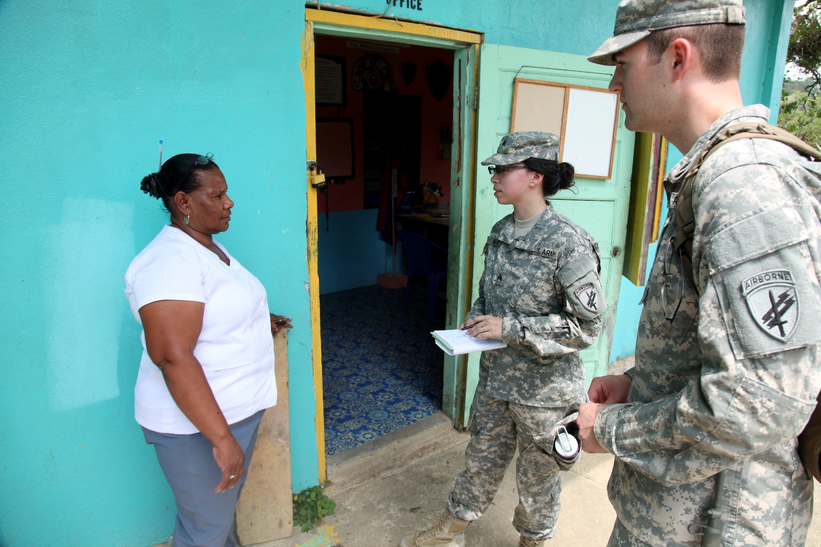 Soldiers with 399th Tactical Psychological Operations Company ask permission of local school headmaster to post information outside school in Cristo Rey, Belize, April 24, 2017 (U.S. Army/Joshua E. Powell)