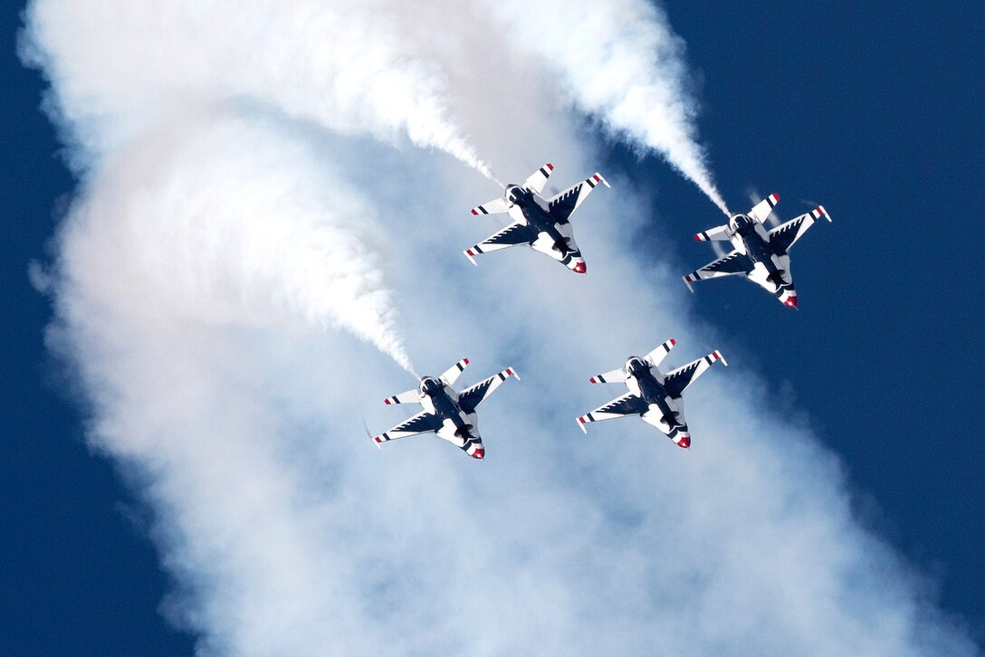 The U.S. Air Force Thunderbirds Demonstration Team performs a tightly choreographed drill.
