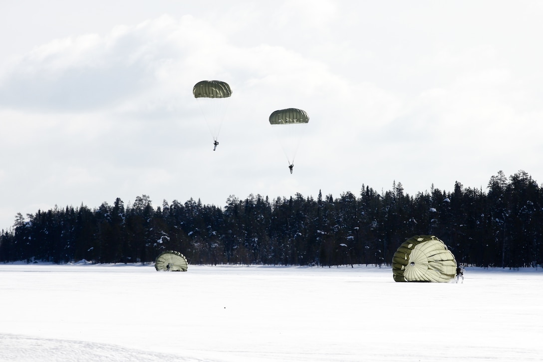 U.S. Army 10th Special Forces Group (Airborne) Soldiers jump with Finnish, Polish, and Estonian special operations forces from Lockheed C-130 Hercules during airborne operations over Rovaniemi, Finland, March 14, 2018, as part of Finnish-led Northern Griffin 18 (U.S. Army/Kent Redmond)