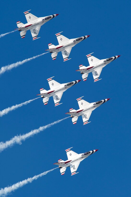 The U.S. Air Force Thunderbirds Demonstration Team enacts their signature close-formation maneuver.