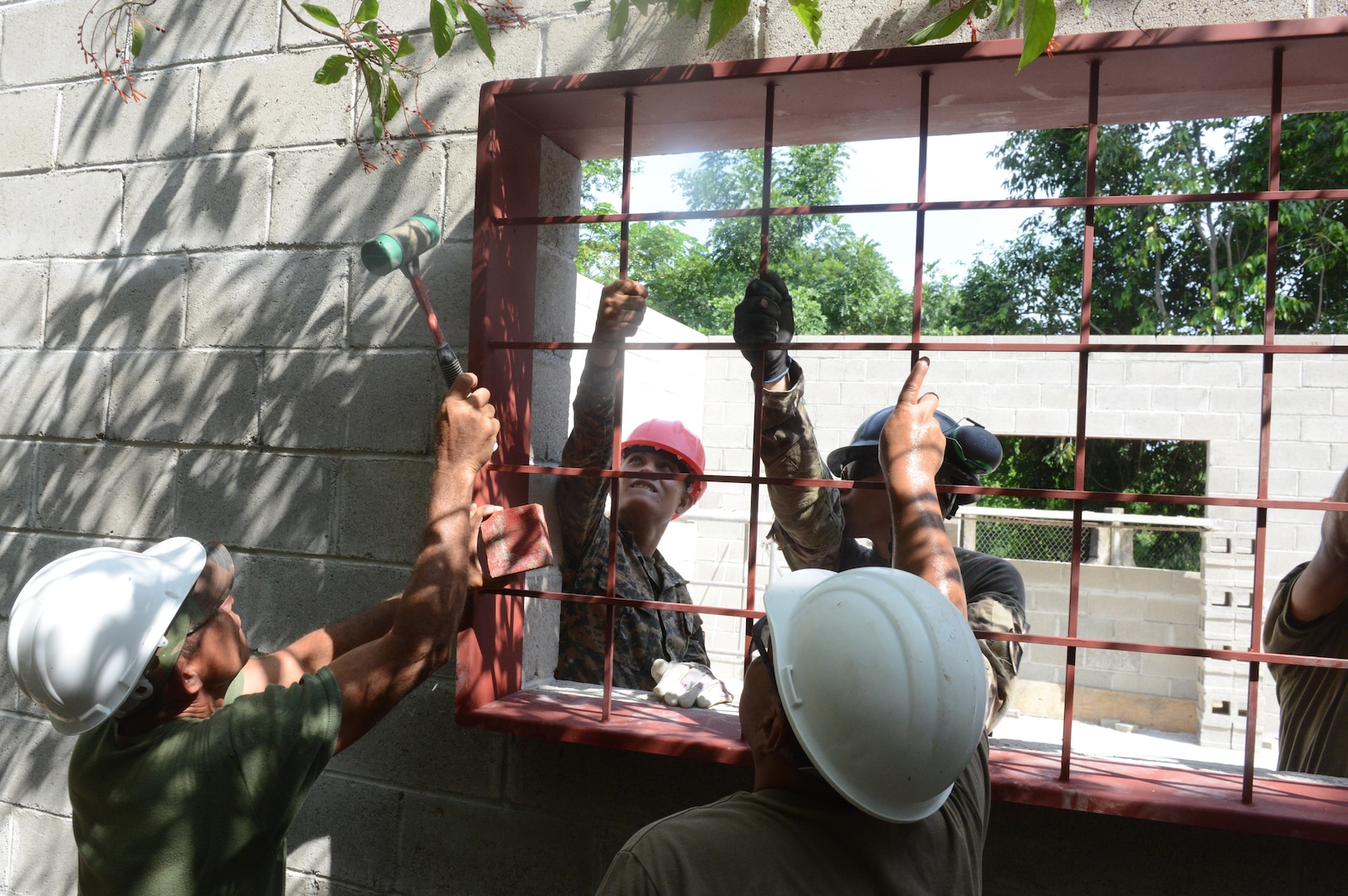 Soldiers from the U.S. and El Salvador build an addition to a school at Santa Rita, June 25, 2018, in La Paz Department, El Salvador. The construction is part of U.S. Army South-led Beyond the Horizon exercise lasting May 12 through Aug. 4.