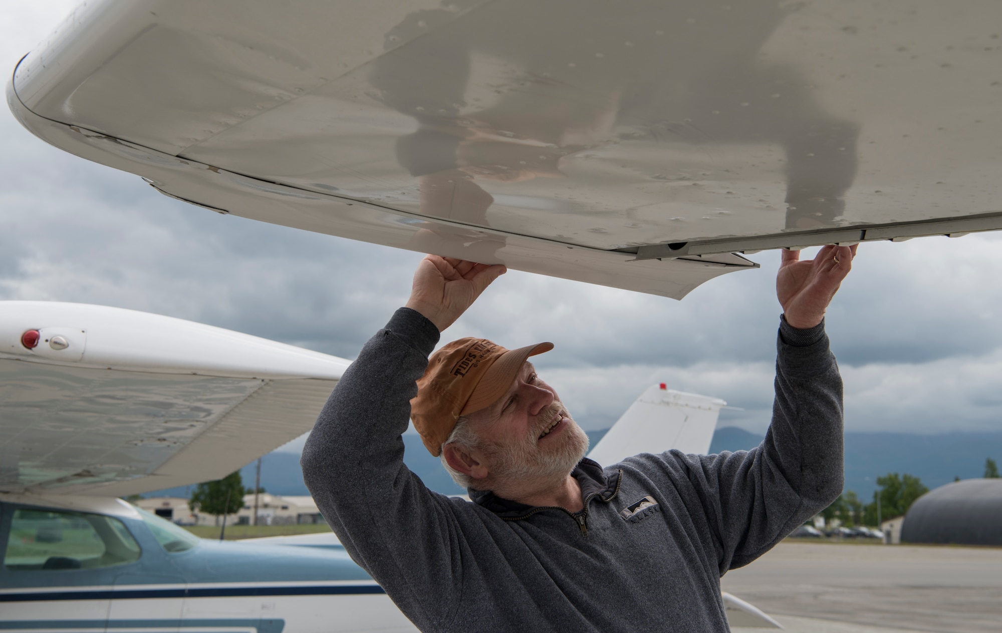 David Price, an Elmendorf Aero Club member, performs a pre-flight inspection of the Aircraft he is renting from the club at Joint Base Elmendorf-Richardson, Alaska, June 25, 2018. The club is open to all active-duty, retirees, Department of Defense civilians, National Guard and Reserve employees and dependents. A monthly membership includes the use of available rentable airplanes and for some additional fees, the instruction and rentable hangar spaces are available.