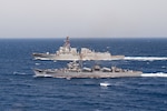 The Egyptian Navy ship El Zafer (F951), front, steams alongside the guided-missile destroyer USS Jason Dunham (DDG 109) during a passing exercise (PASSEX).  Dunham is deployed to the U.S. 5th Fleet area of operations in support of naval operations to ensure maritime stability and security in the Central region, connecting the Mediterranean and the Pacific through the western Indian Ocean and three strategic choke points. (U.S. Navy photo by Mass Communication Specialist 3rd Class Jonathan Clay/Released)