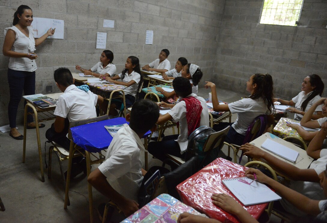 Liliana Vasquez teaches eighth graders English in a makeshift school at El Amato, El Salvador. Soldiers from the U.S. and El Salvador are building an addition to a school at Santa Rita, June 25, 2018, in La Paz Department, El Salvador, which should be finished by the end of July 2018.