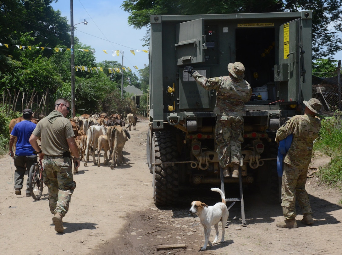 Soldiers prepare to pump drinking water into a bladder at a school construction site, June 25, 2018, in La Paz Department, El Salvador. The construction is part of U.S. Army South-led Beyond the Horizon exercise lasting May 12 through Aug. 4, 2018.
