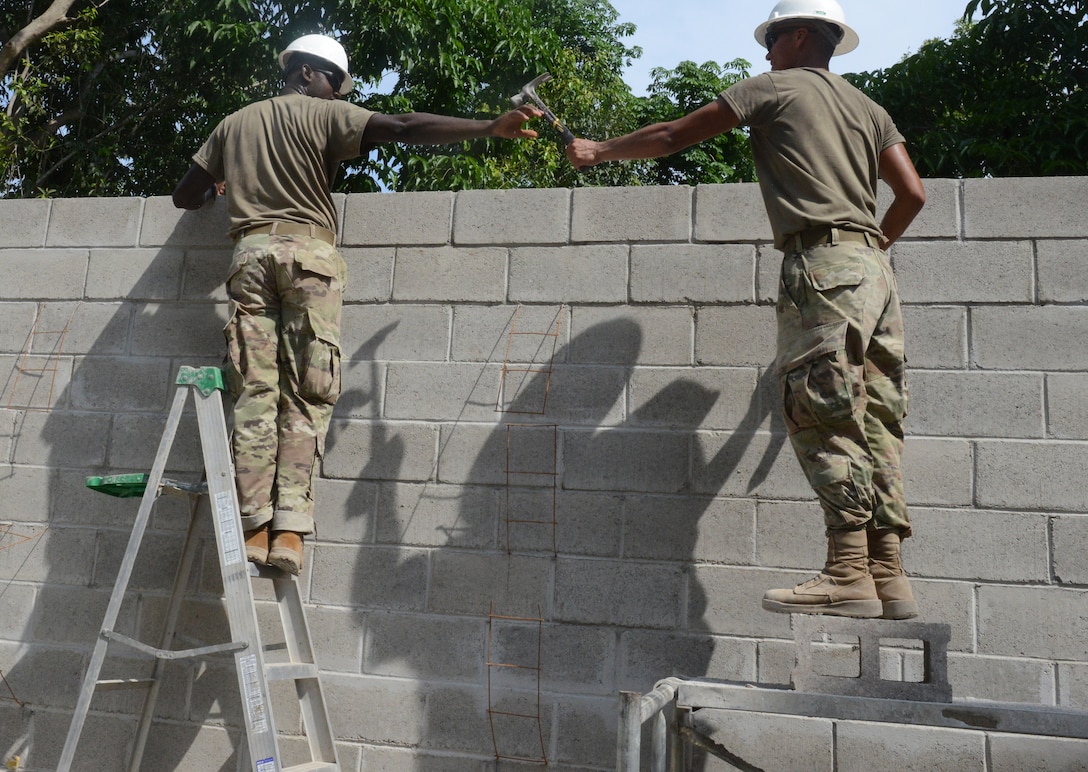 Soldiers build an addition to a school at Santa Rita, June 25, 2018, in La Paz Department, El Salvador. The construction is part of U.S. Army South-led Beyond the Horizon exercise lasting May 12 through Aug. 4, 2018.