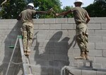 Soldiers from the U.S. and El Salvador build an addition to a school at Santa Rita, June 25, 2018, in La Paz Department, El Salvador. The construction is part of U.S. Army South-led Beyond the Horizon exercise lasting May 12 through Aug. 4.