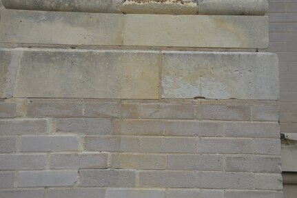 A photo taken after the exterior of the historic Main Post Chapel, or Gift Chapel, at Joint Base San Antonio-Fort Sam Houston underwent a steam cleaning in late April shows the black mold had been taken off a section of masonry in the back of the chapel. The cleaning got rid of dirt, pollution, organic material and the black mold that had formed and accumulated overtime on the exterior of the building. The cleaning of the Main Post Chapel was conducted following guidelines for the cleaning of historic masonry buildings by the U.S. Department of Interior and the National Park Service.