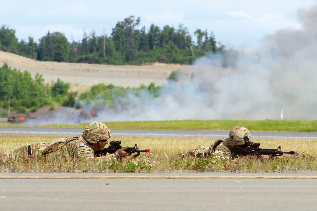 Soldiers provide security after taking an airfield during a demonstration.