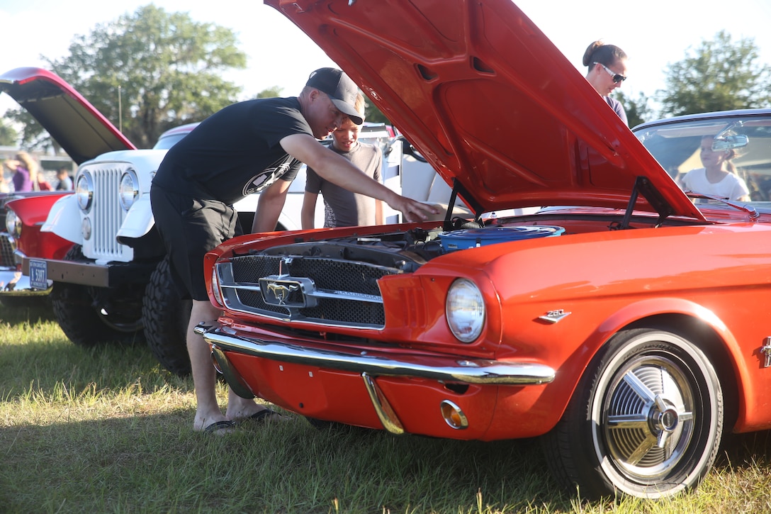 Gunnery Sgt. Jeff Weathern looks inside a classic car with his son during an Independence Day celebration aboard
Marine Corps Recruit Depot Parris Island July 4. Weathern is a drill instructor with Echo Company.
