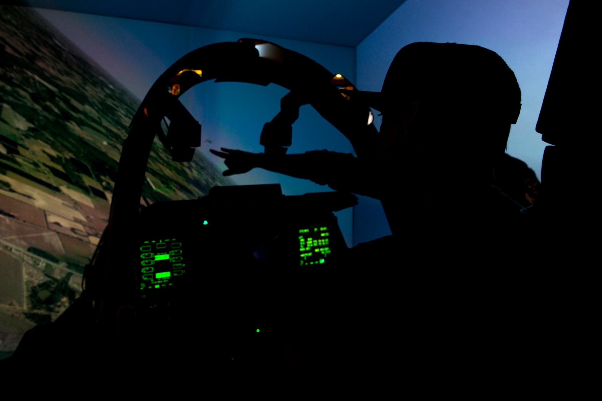 Keifer Thompson, lead singer of country band Thompson Square, operates an A-10 Thunderbolt II simulator prior to the Patriot Festival, July 3, 2018, at Moody Air Force Base, Ga. Team Moody hosted the free event to allow Airmen and their families an opportunity to take some time away from the mission and enjoy a Fourth of July experience. The event consisted of live music, food trucks, family fun and a firework show. (U.S. Air Force photo by Airman 1st Class Erick Requadt)