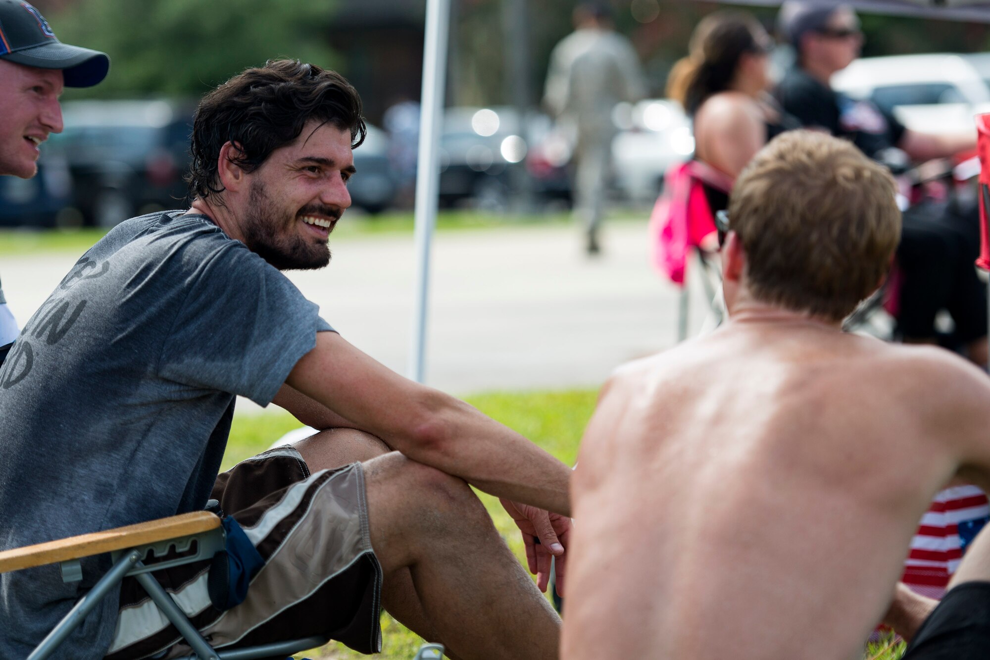 Participants share a smile during the Patriot Festival, July 3, 2018, at Moody Air Force Base, Ga. Team Moody hosted the free event to allow Airmen and their families an opportunity to take some time away from the mission and enjoy a Fourth of July experience. The event consisted of live music, food trucks, family fun and a firework show. (U.S. Air Force photo by Airman 1st Class Erick Requadt)