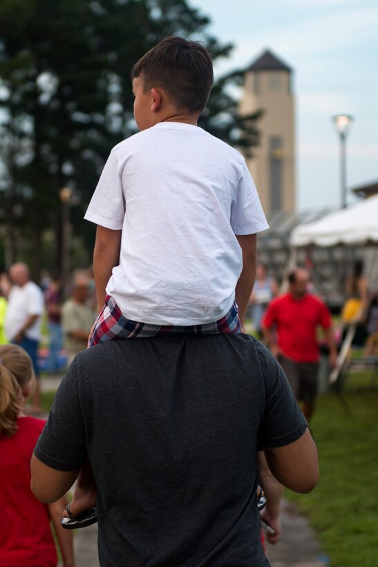 Participants explore festivities during the Patriot Festival, July 3, 2018, at Moody Air Force Base, Ga. Team Moody hosted the free event to allow Airmen and their families an opportunity to take some time away from the mission and enjoy a Fourth of July experience. The event consisted of live music, food trucks, family fun and a firework show. (U.S. Air Force photo by Airman 1st Class Erick Requadt)