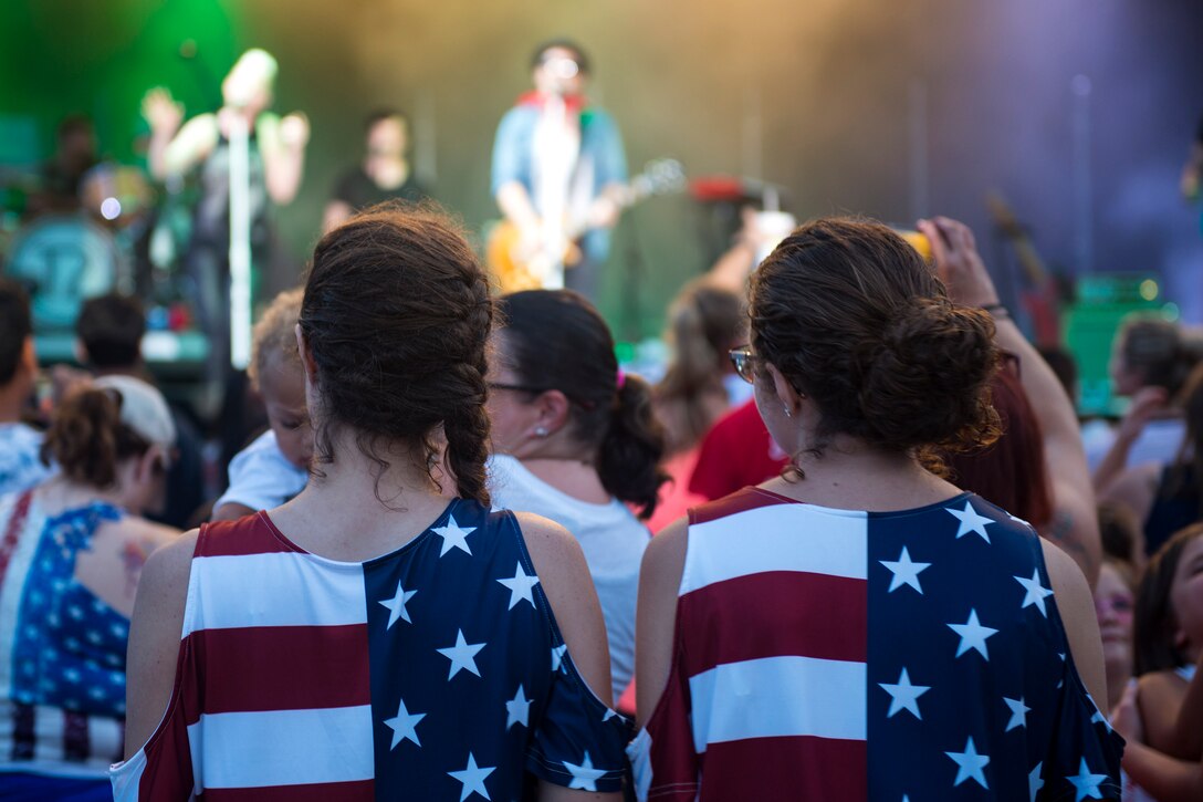 Participants watch the country band Thompson Square perform at a concert during the Patriot Festival, July 3, 2018, at Moody Air Force Base, Ga. Team Moody hosted the free event to allow Airmen and their families an opportunity to take some time away from the mission and enjoy a Fourth of July experience. The event consisted of live music, food trucks, family fun and a firework show. (U.S. Air Force photo by Airman 1st Class Erick Requadt)