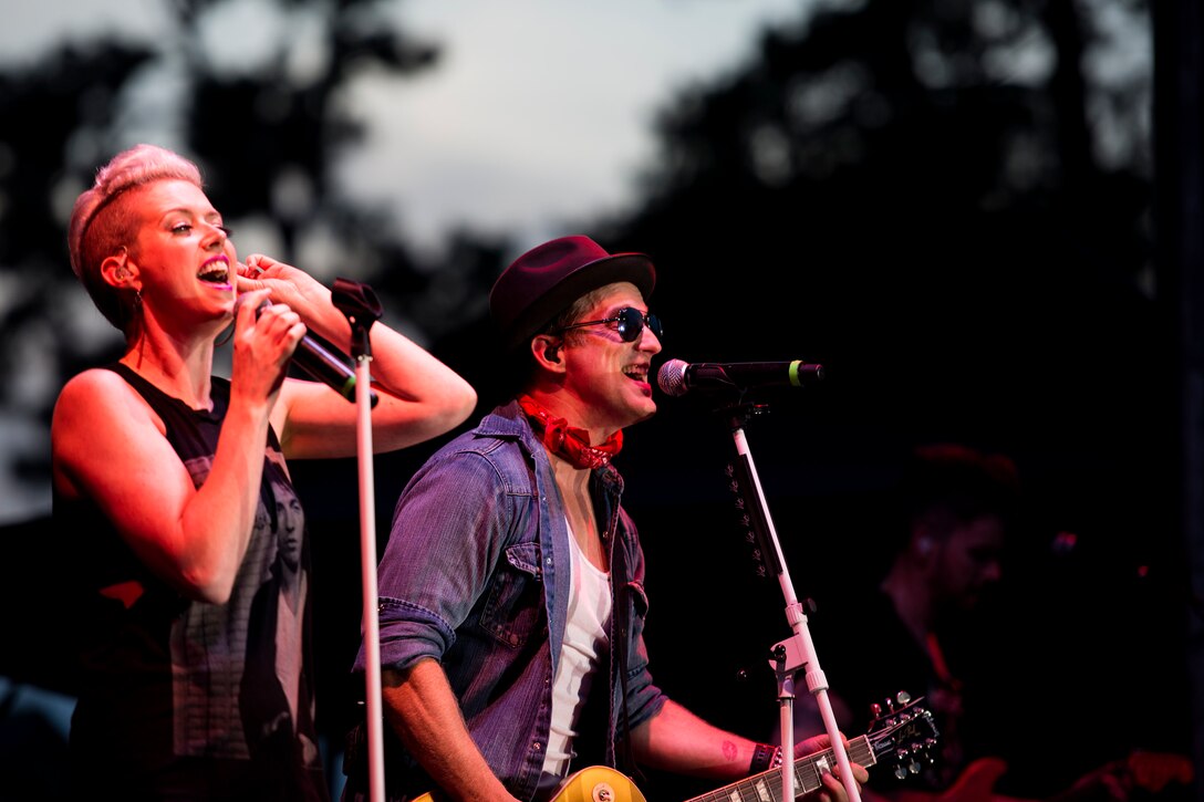 Keifer, right, and Shawna Thompson, lead singers of country band Thompson Square, perform a concert during the Patriot Festival, July 3, 2018, at Moody Air Force Base, Ga. Team Moody hosted the free event to allow Airmen and their families an opportunity to take some time away from the mission and enjoy a Fourth of July experience. The event consisted of live music, food trucks, family fun and a firework show. (U.S. Air Force photo by Airman 1st Class Erick Requadt)