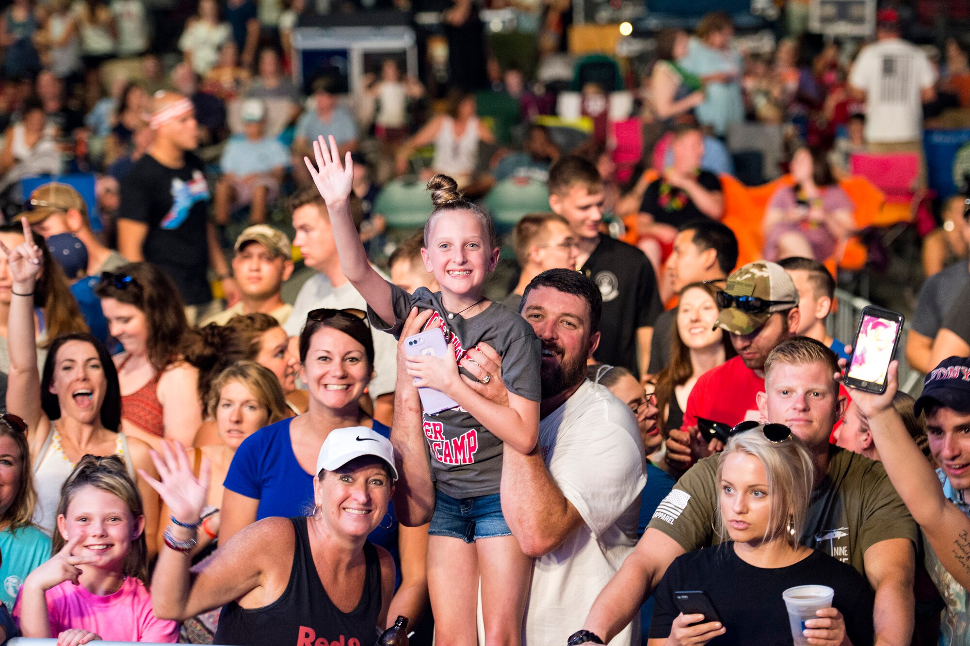 Participants gather for a concert during the Patriot Festival, July 3, 2018, at Moody Air Force Base, Ga. Team Moody hosted the free event to allow Airmen and their families an opportunity to take some time away from the mission and enjoy a Fourth of July experience. The event consisted of live music, food trucks, family fun and a firework show. (U.S. Air Force photo by Airman 1st Class Erick Requadt)