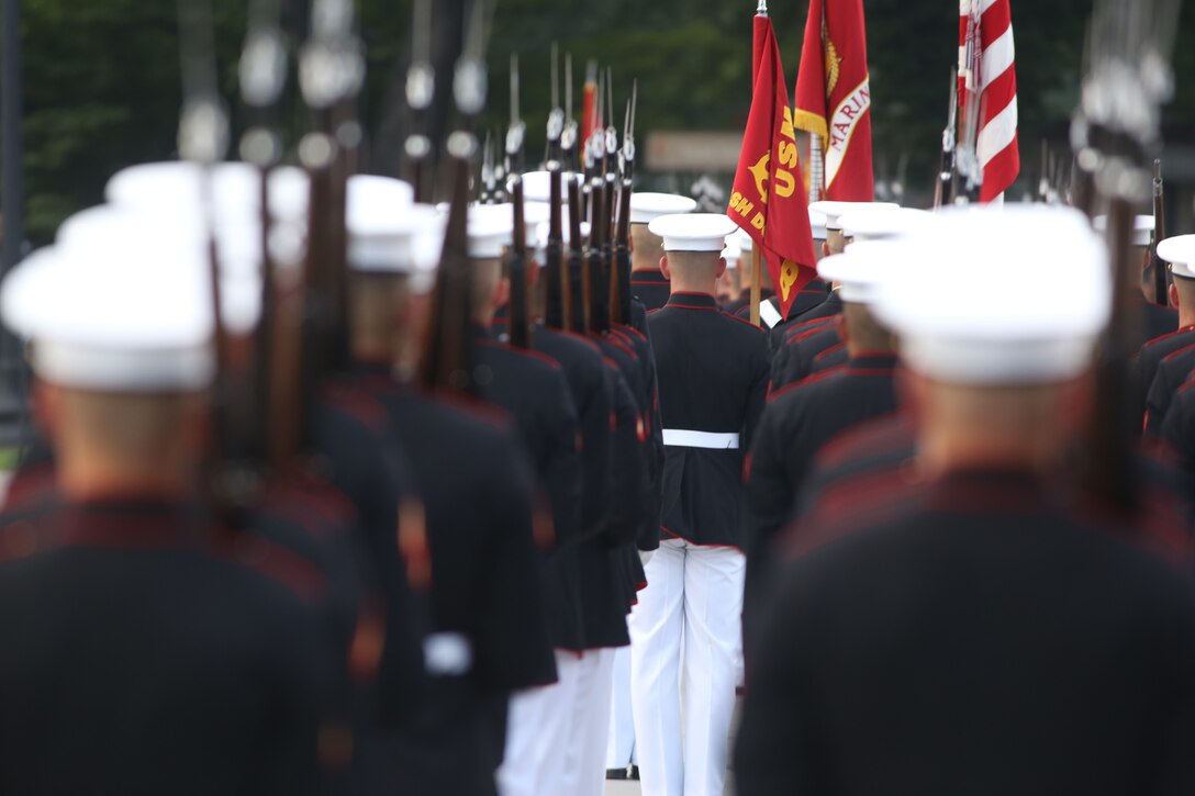 Marines with Marine Barracks Washington D.C. stand at “right shoulder arms” during a Tuesday Sunset Parade at the Lincoln Memorial, Washington, D.C., July 3, 2018. The guest of honor for the parade was Vice Adm. Walter E. “Ted” Carter, 62nd superintendent of the U.S. Naval Academy, and the hosting official was Lt. Gen. Robert S. Walsh, commanding general, Marine Corps Combat Development Command, and deputy commandant, Combat Development and Integration.(Official U.S. Marine Corps photo by Lance Cpl. James Bourgeois/Released)