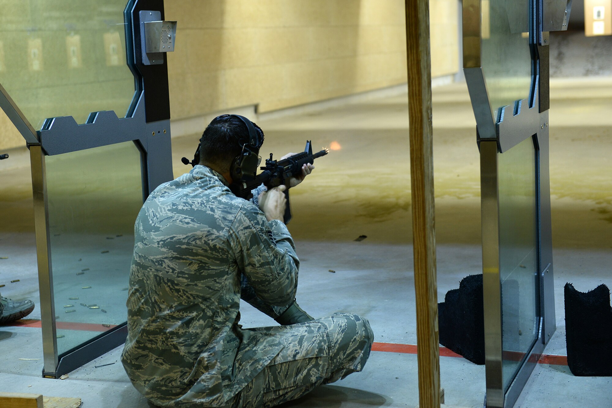 Staff Sgt. Tyler Senecal, 55th Security Forces Squadron training instructor, fires a M-16 rifle at a paper target during an excellence in competition and shooting event May 14, 2018, at Offutt Air Force Base, Nebraska. Offutt’s defenders participated in local events as well as coordinating base events to recognize the contributions of police across the nation. (U.S. Air Force photo by Charles J. Haymond)