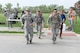 55th Security Forces Squadron Airmen begin to run during a ruck march challenge May 14, 2018, at Offutt Air Force Base, Nebraska. Team two ran and walked 2 miles from the Patriot Club parking lot to Peacekeeper Drive in 38 minutes and 25 seconds to earn first place in this challenge.  (U.S. Air Force photo by Charles J. Haymond)