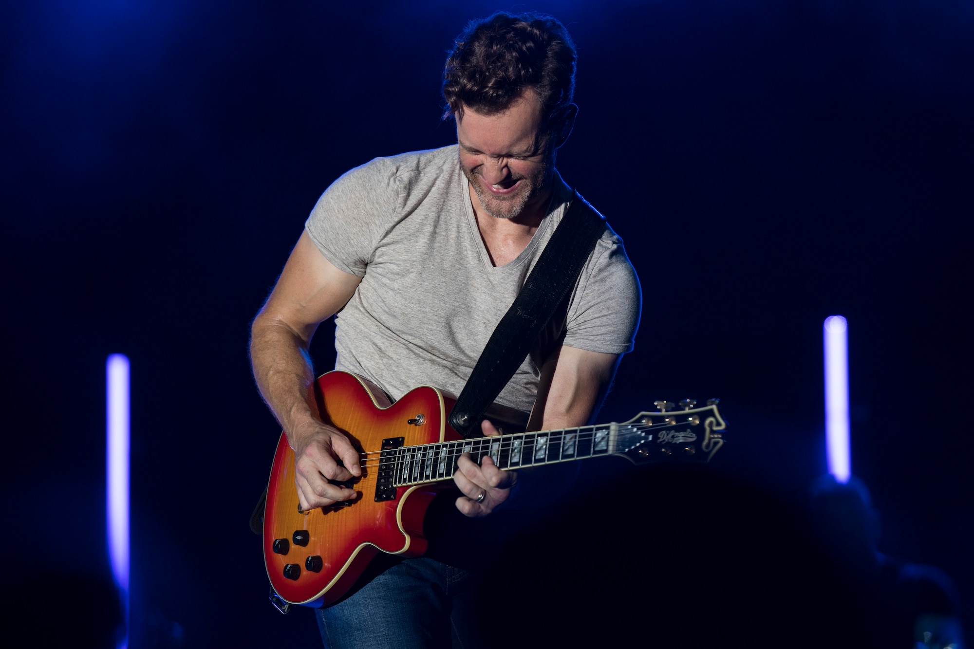 A guitarist performing with Easton Corbin Crew plays a solo during Patriot Fest, July 3, 2018, at Moody Air Force Base, Ga. Team Moody hosted the free event to allow Airmen and their families an opportunity to take some time away from the mission and enjoy a Fourth of July experience. The event consisted of live music, food trucks, family fun and a fireworks show. (U.S. Air Force photo by Senior Airman Janiqua P. Robinson)