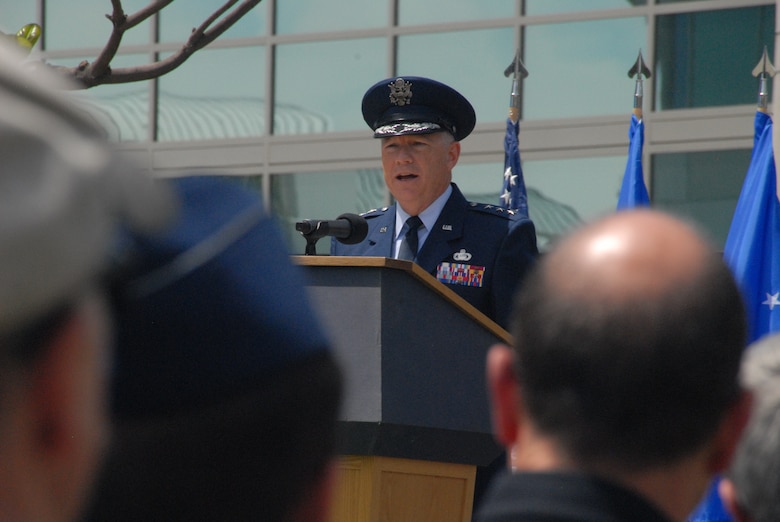 Gen. John F. Thompson, commander of the Space and Missile Systems Center, addresses family members and civic leaders from the surrounding South Bay beach cities in attendance to honor six new Air Force and civilian space pioneers, whose names are newly inscribed on a wall of polished black granite at the General Bernard A. Schriever Memorial, located on the grounds of the Space and Missile Systems Center at Los Angeles Air Force Base in El Segundo, California, May 14, 2018. (U.S. Air Force photo/James Spellman, Jr.)