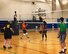 Wearing the number two at center, Master Sgt. Dawn Williams, 932nd Health Professions Recruiter, "coaches" a team mate and watches the ball being spiked over the net at Scott Air Force Base, Ill. She recruits new medical people into the Air Force Reserve by day at the 932nd Airlift Wing, and also coaches the 932nd Airlift Wing's volunteer volleyball team by night. They practice a variety of times and play fun, but competitive games against other Scott units in the James Gym. (U.S. Air Force photo by Lt. Col. Stan Paregien)