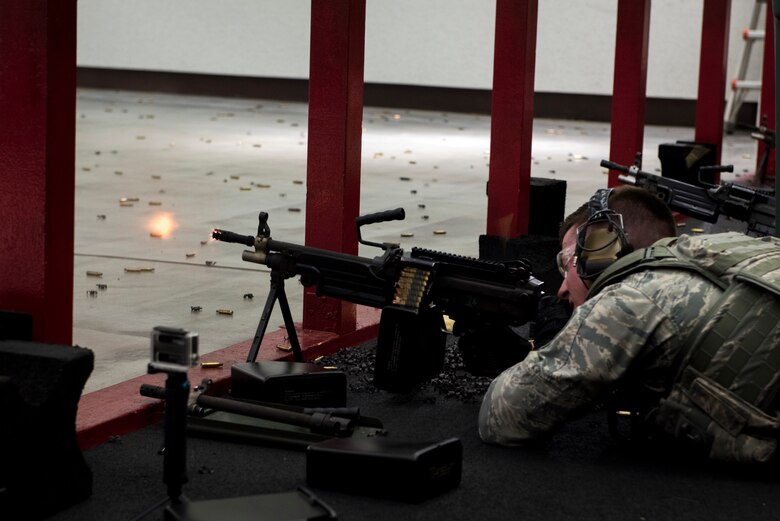 Staff Sgt. Daniel Lanata, 374th Security Forces Squadron 2018 Security Forces Advanced Combat Skills Assessment team member, fires the M249 light machine gun during training, May 31, 2018, at Yokota Air Base, Japan.