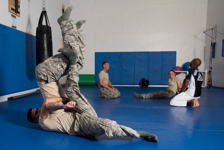 Members of the 374th Security Forces Squadron 2018 Security Forces Advanced Combat Skills Assessment team practice hand-to-hand combat, May 31, 2018, at Yokota Air Base, Japan.