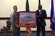 Col. John Kent, 48th Fighter Wing vice commander, presents a farewell gift to Edward Cole, 48th Fighter Wing community support director, during Cole’s retirement ceremony at Royal Air Force Lakenheath, England, June 29, 2018. Cole worked at 11 bases during his military career and over six bases during his civil service career. (U.S. Air Force photo/ Airman 1st Class John A. Crawford)